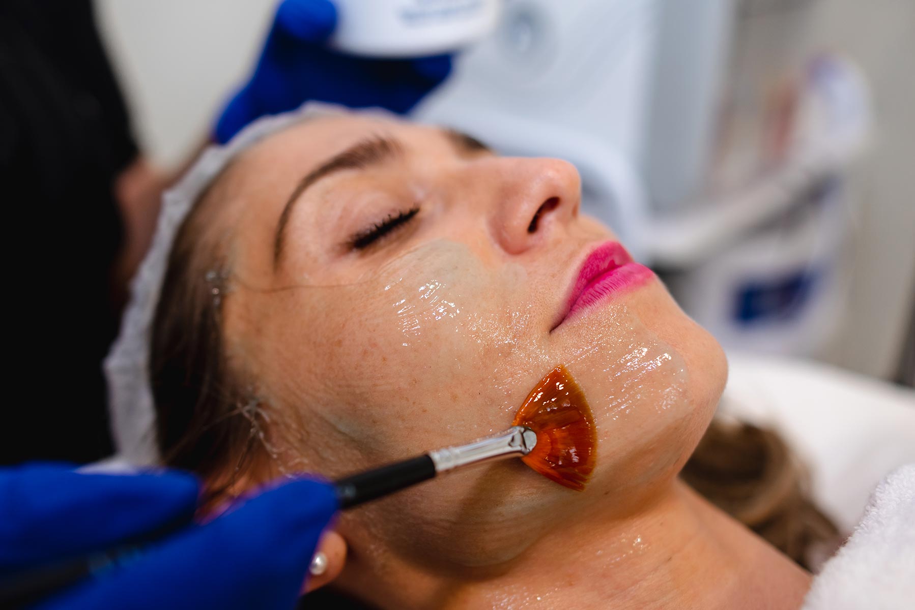 Portrait blond girl in facial mask. Beauty and skin care.